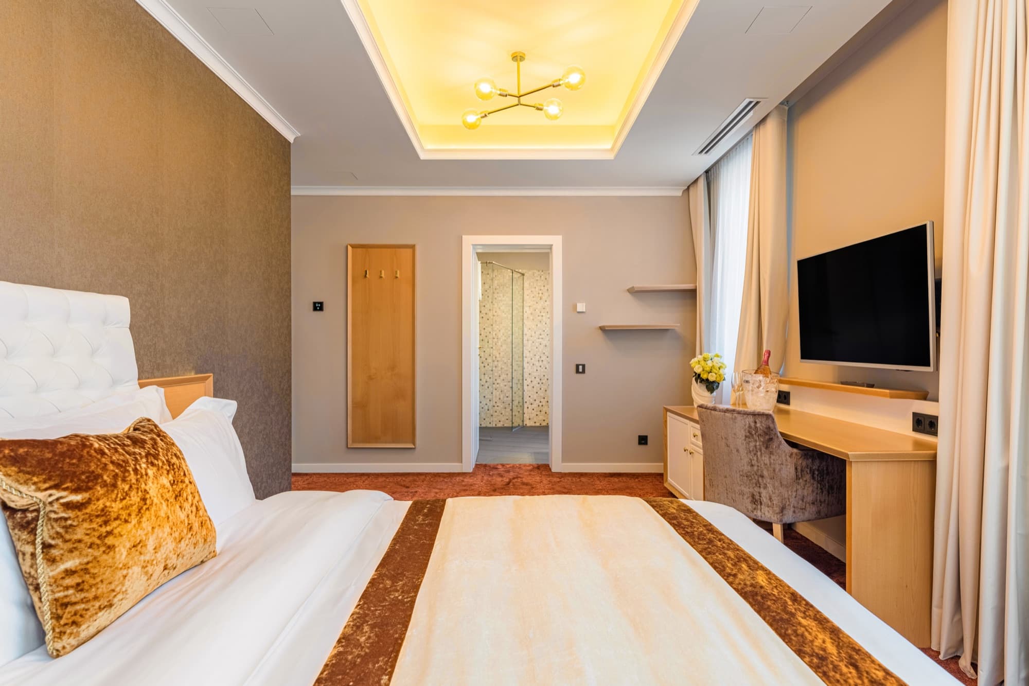 Room entrance and wardrobe at Pergola Boutique Hotel Bucharest