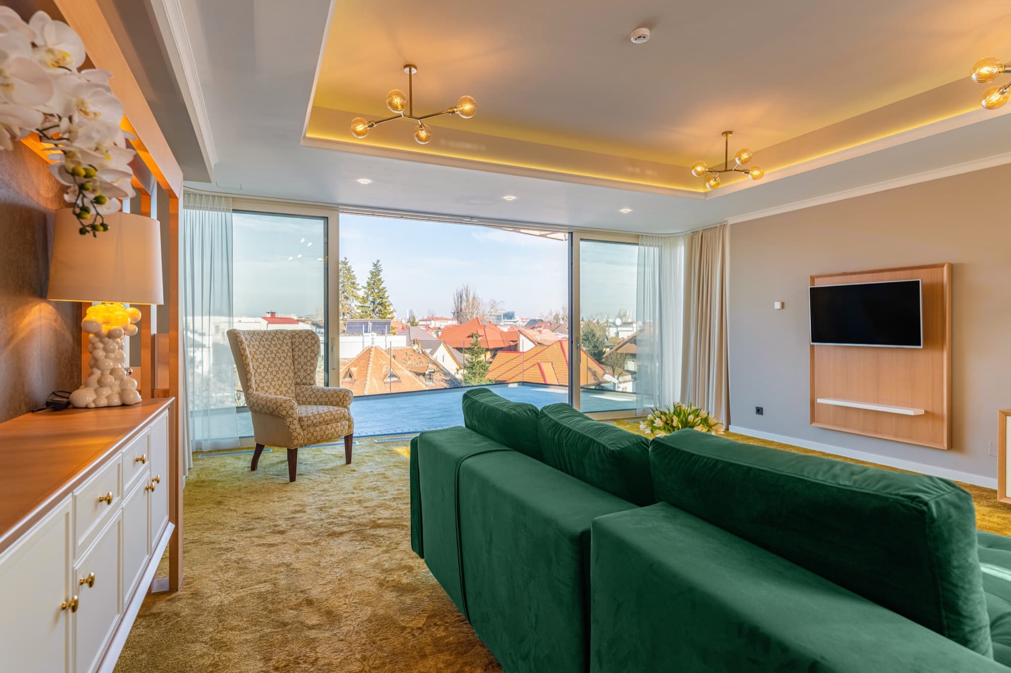 Room with lounge and city view at Pergola Boutique Hotel Bucharest